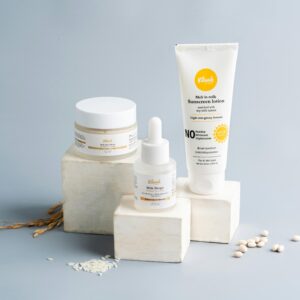 Elegant skincare and sunscreen products on a gray backdrop. Ideal for beauty marketing.
