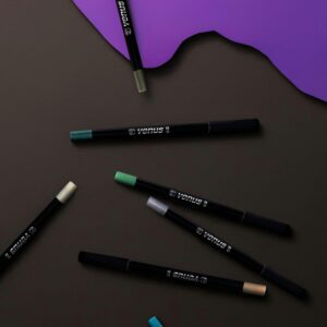 Stylish arrangement of vibrant eyeliners on a rich dark backdrop with purple accents, perfect for beauty and fashion editorial.